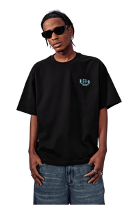Model wearing a black MEDM SS25 Basic Embroidery Tee paired with stylish sunglasses and denim shorts