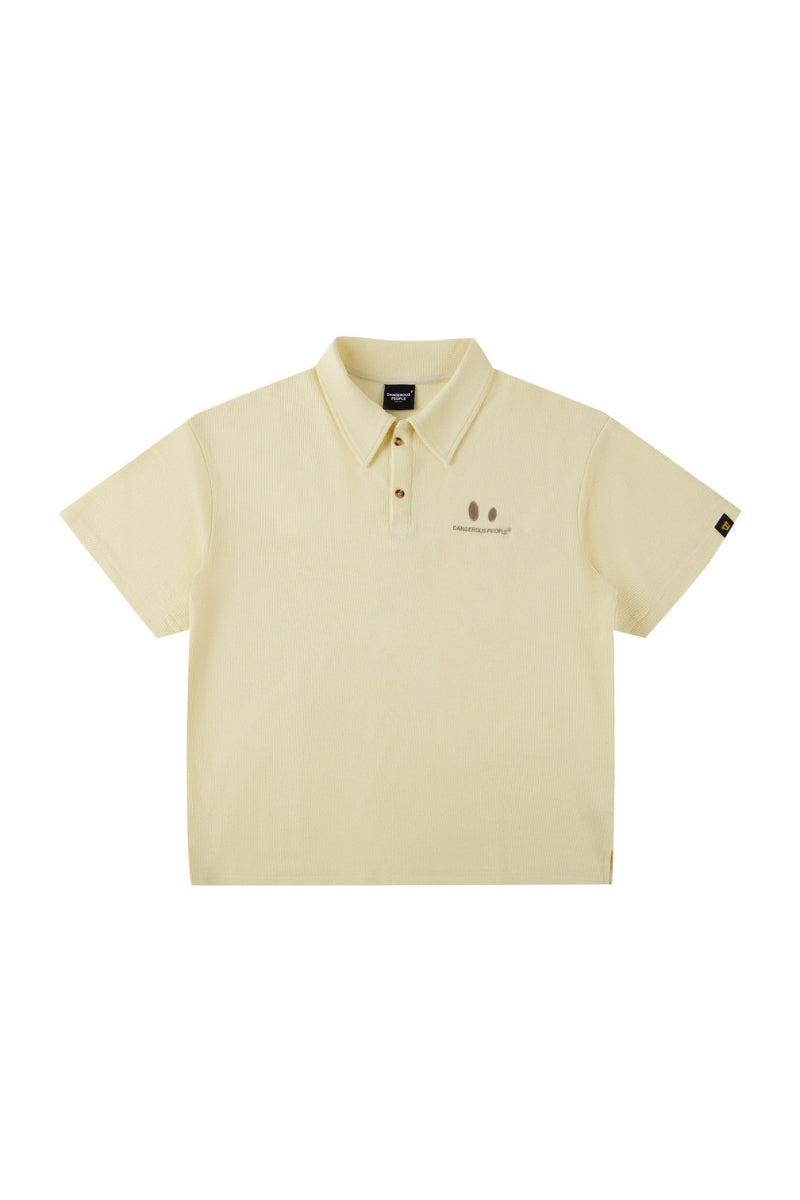 DangerousPeople DSP｜Textured Small‑Eye Graphic Boxy Fit Couple Short‑Sleeve Polo Shirt