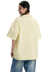 DangerousPeople DSP｜Textured Small‑Eye Graphic Boxy Fit Couple Short‑Sleeve Polo Shirt