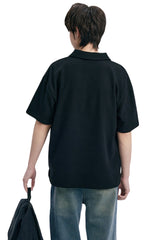 DangerousPeople DSP｜Textured Small‑Eye Graphic Boxy Fit Couple Short‑Sleeve Polo Shirt