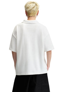 DangerousPeople DSP｜Textured Small‑Eye Graphic Boxy Fit Couple Short‑Sleeve Polo Shirt
