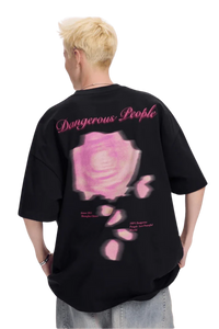 Men's Dangerous People blurred rose graphic tee featuring a vibrant pink rose design on a black background