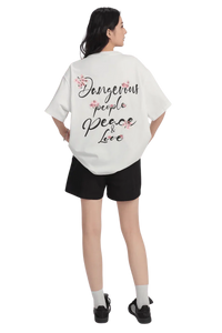 White Cherry Blossom Tee from Dangerous People with bold text and floral design on the back