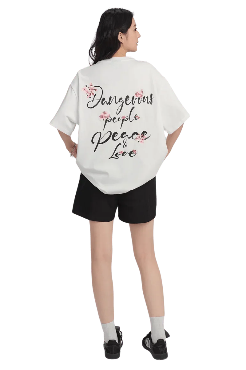 White Cherry Blossom Tee from Dangerous People with bold text and floral design on the back