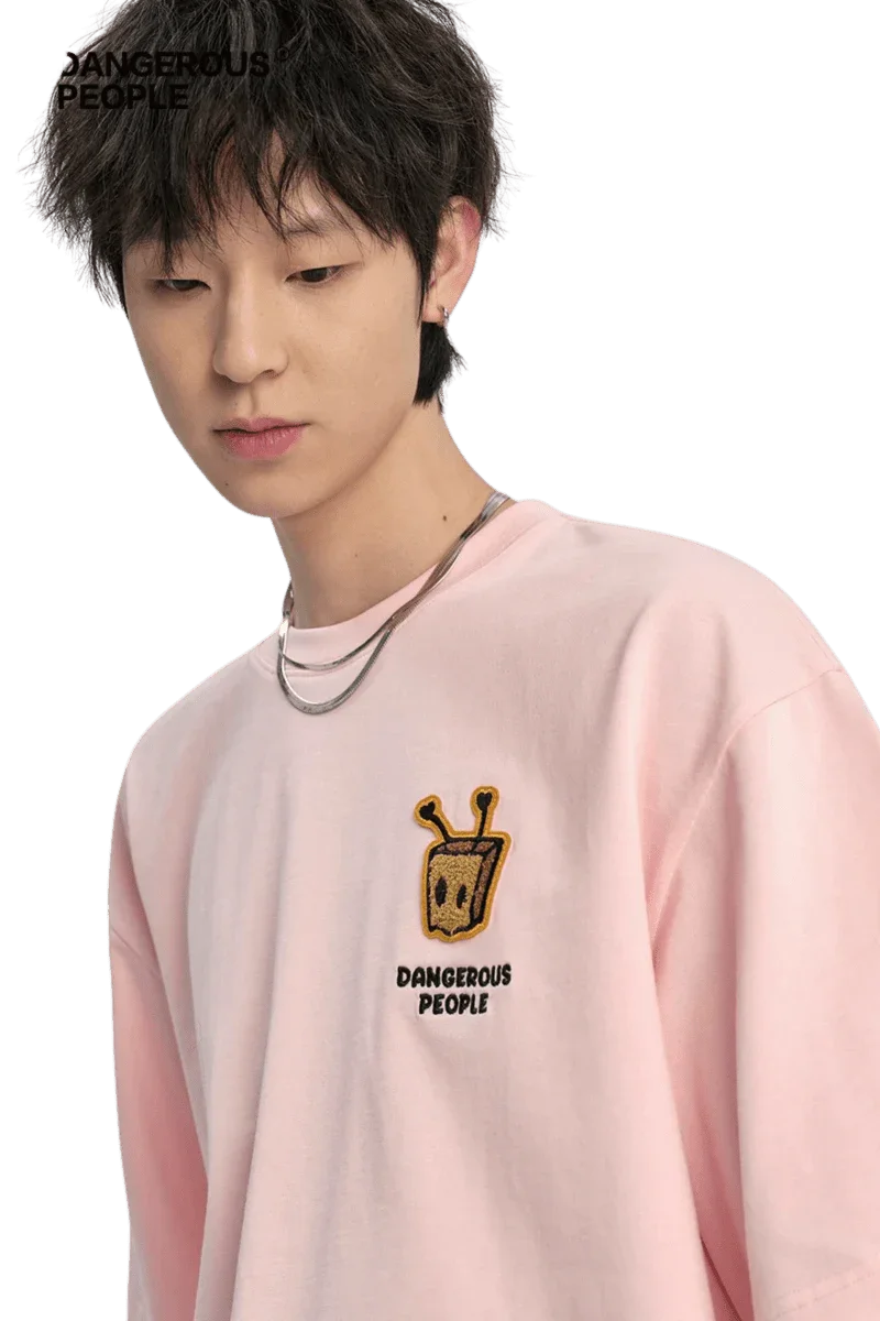 Bee Paper Bag Embroidery Logo Tee in pink by Dangerous People featuring a unique embroidered design