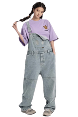 Model wearing a purple Bee Paper Bag Embroidery Logo Tee paired with denim overalls for a trendy look