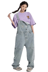 Model wearing a purple Bee Paper Bag Embroidery Logo Tee paired with denim overalls for a trendy look