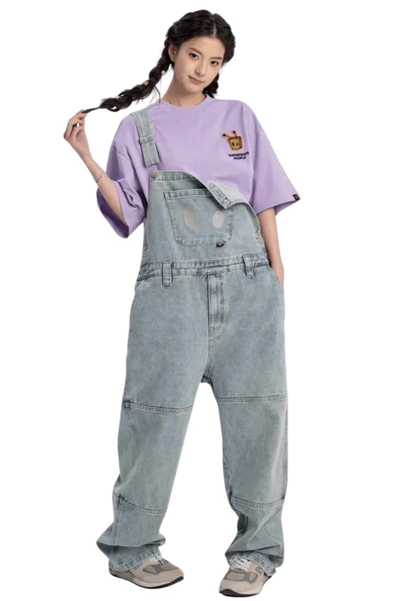 Model wearing a purple Bee Paper Bag Embroidery Logo Tee paired with denim overalls for a trendy look
