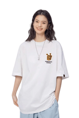 Model wearing a white Bee Paper Bag Embroidery Logo Tee from Dangerous People for a trendy look