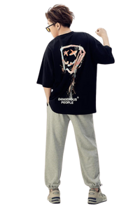 Back view of a black Dangerous People graphic tee featuring a bold design and relaxed fit