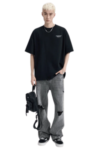 Dark oversized Dangerous People Ice Cube Tee paired with distressed gray jeans for a stylish look