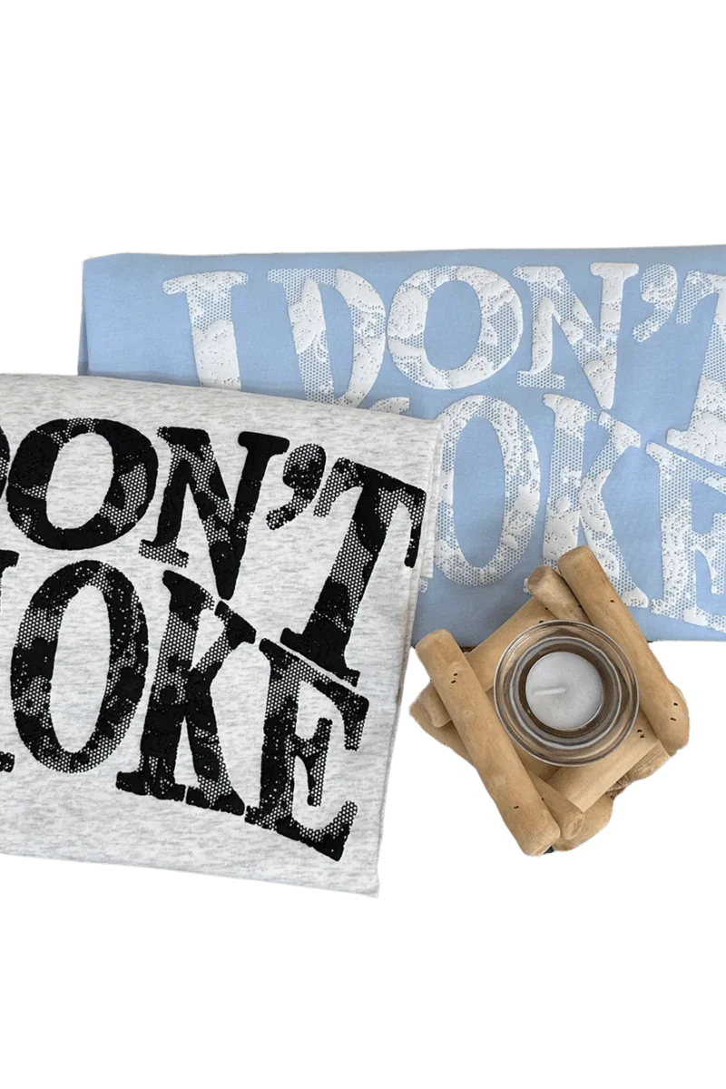 IDontSmoke Sorona material graphic tee in light blue and gray with bold distressed logo design