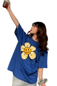 Model wearing Drew House Daisy SS Tee in blue featuring a large flower graphic