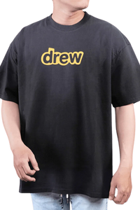 Drew House Secret SS Tee in black featuring classic yellow 'drew' logo for casual style