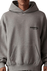 Men's grey hoodie featuring SS22 Flocked Logo Hoodie design with front pocket and relaxed fit