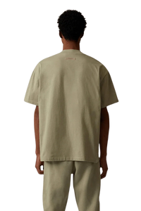 ShaLaoBan SS22 Tee in beige, featuring a relaxed fit and minimalist design, showcased from the back