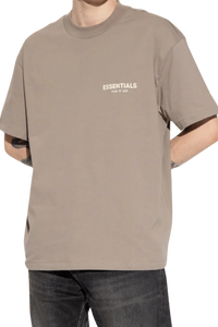 ShaLaoBan SS22 Tee in beige with 'ESSENTIALS' printed on the chest for casual style