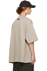 Fear Of God Essentials SS24 Heavy Jersey Arch Logo Tee in beige with a relaxed fit