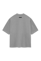 Back view of SS24 Heavy Jersey Arch Logo Tee by Fear Of God Essentials in gray color