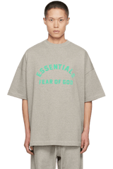 Fear Of God Essentials SS24 Heavy Jersey Arch Logo Tee in gray with bold green lettering