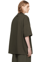 FW23 Black Patch Tee in oversized fit, made from soft material, showcasing a sleek design from Fear Of God Essentials