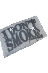 Folded gray IDontSmoke Sorona t-shirt with bold black text and star design on front