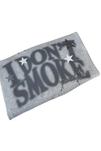 Folded gray IDontSmoke Sorona t-shirt with bold black text and star design on front