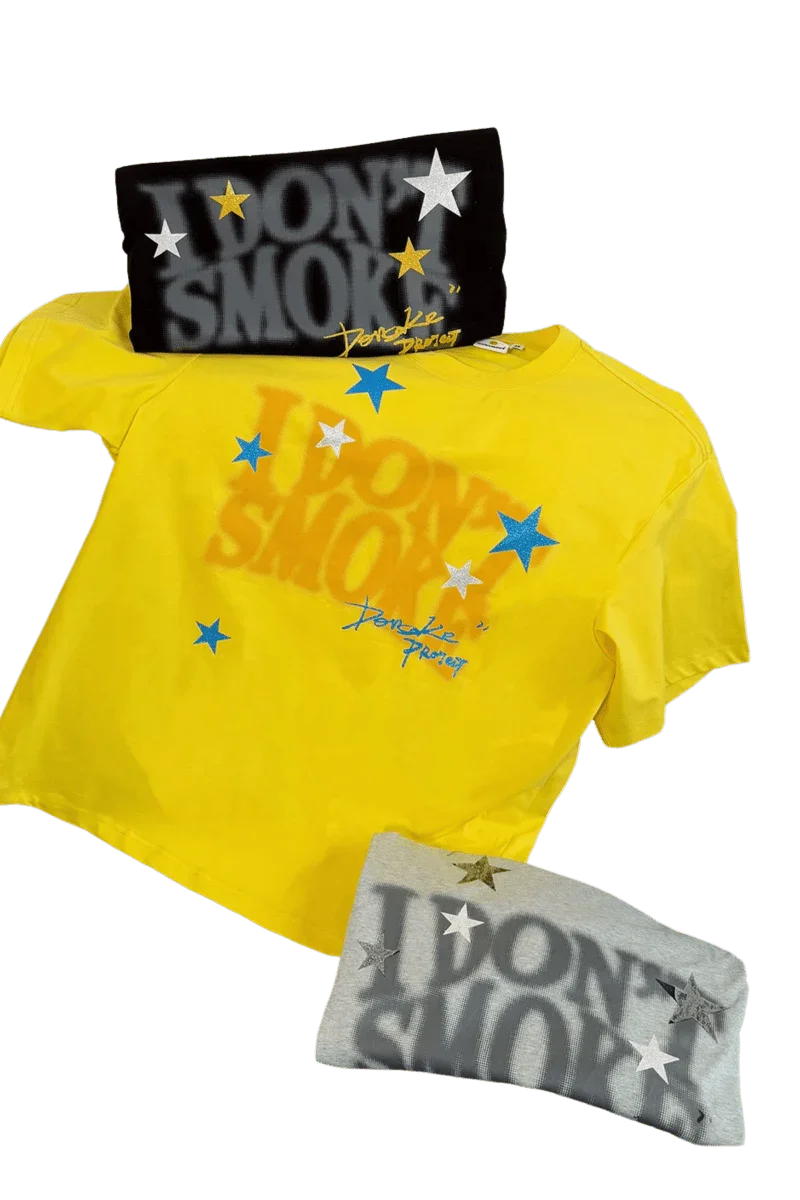 IDontSmoke Sorona t-shirt in bright yellow with logo print and additional gray folded tee with star designs