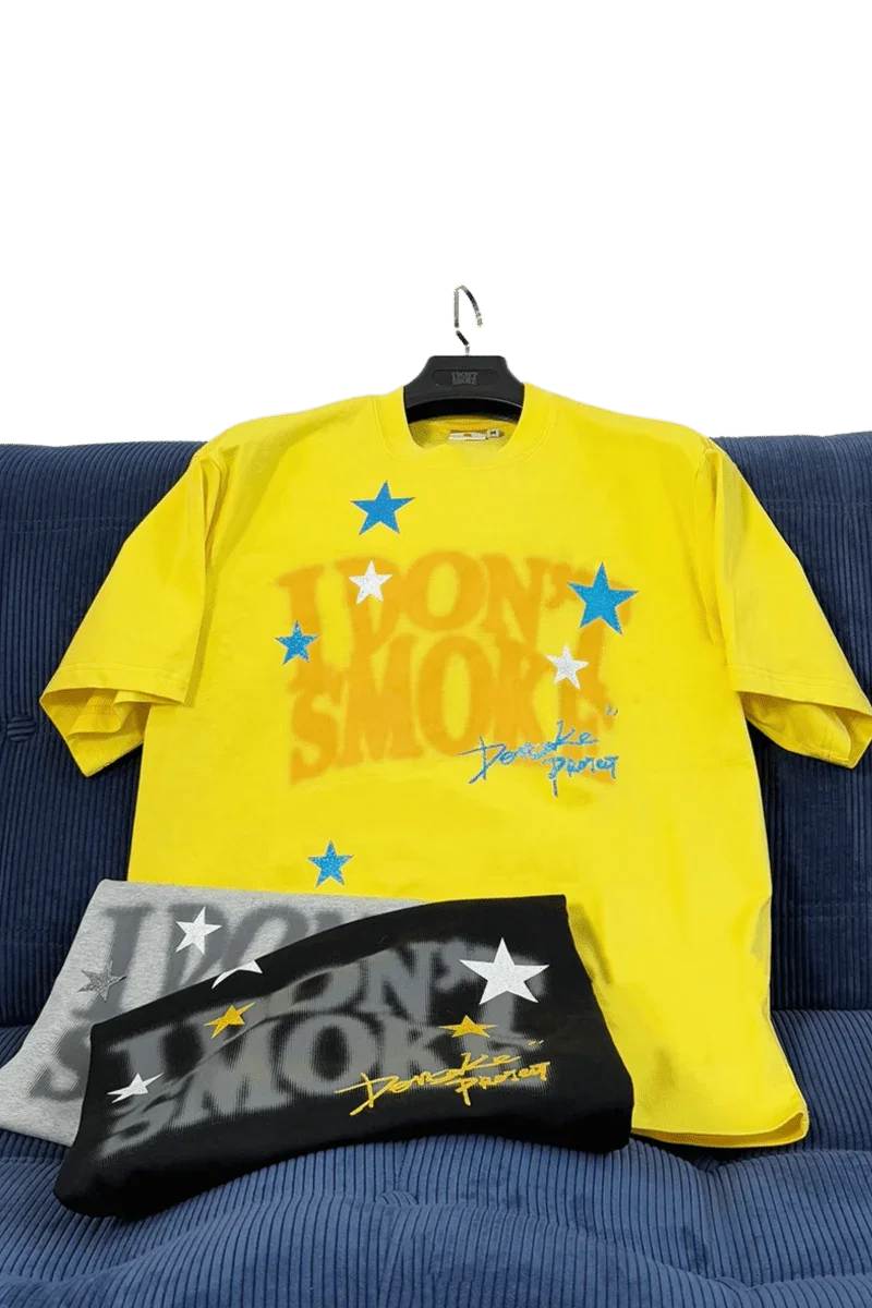 IDontSmoke Sorona t-shirt collection featuring vibrant yellow, black, and gray shirts with star designs
