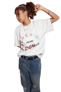 IDontSmoke SS25 Arch Logo Rhinestone Tee worn by a model with layered necklaces and distressed jeans