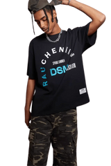 IDontSmoke SS25 Arch Logo Tee black graphic t-shirt worn with camo pants and hat