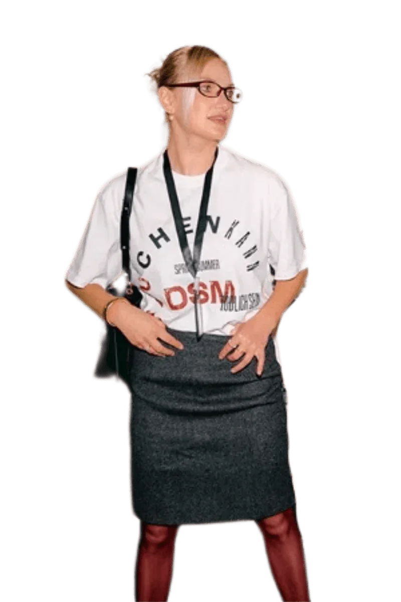 Woman wearing IDontSmoke SS25 Arch Logo Tee white graphic t-shirt paired with a dark skirt and glasses