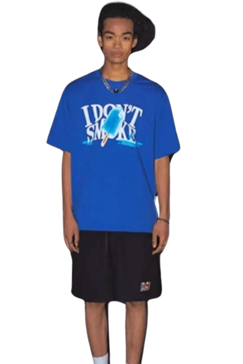 Model wearing a blue IDontSmoke Street Picnic Series Tee with black shorts on black background