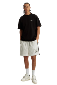 Black Maple Leaf Embroidery Tee from Dangerous People, styled with white shorts for a modern look