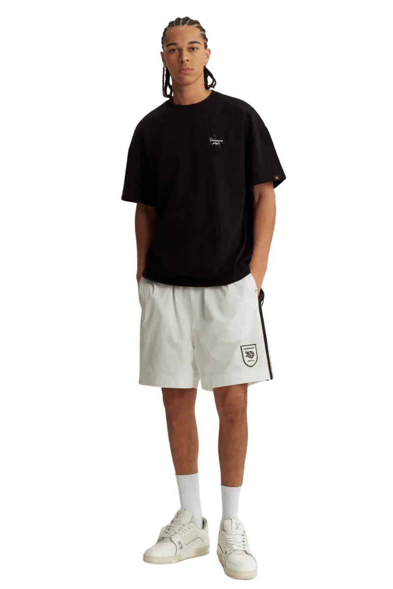 Black Maple Leaf Embroidery Tee from Dangerous People, styled with white shorts for a modern look