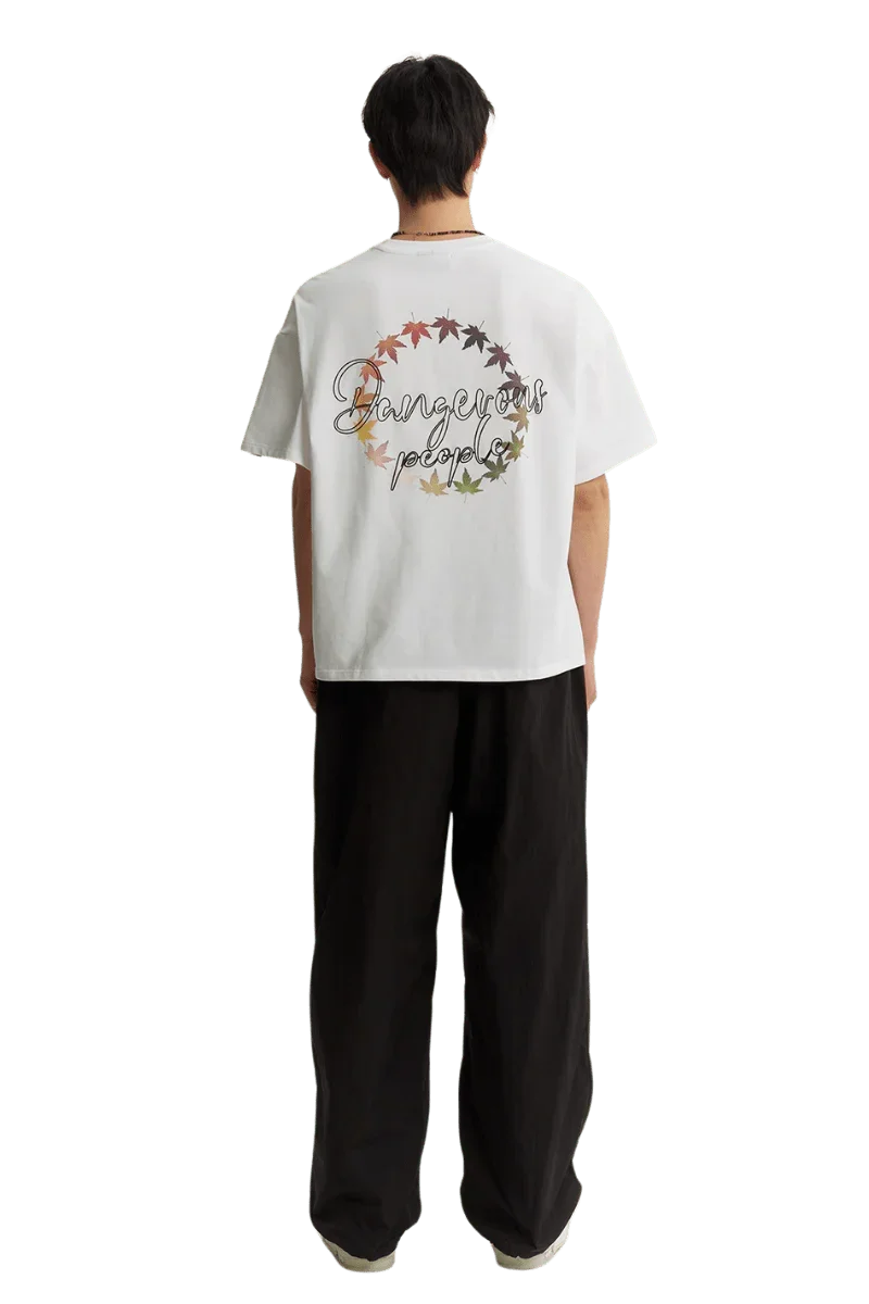 Dangerous People Maple Leaf Embroidery Tee featuring a colorful leaf design on the back