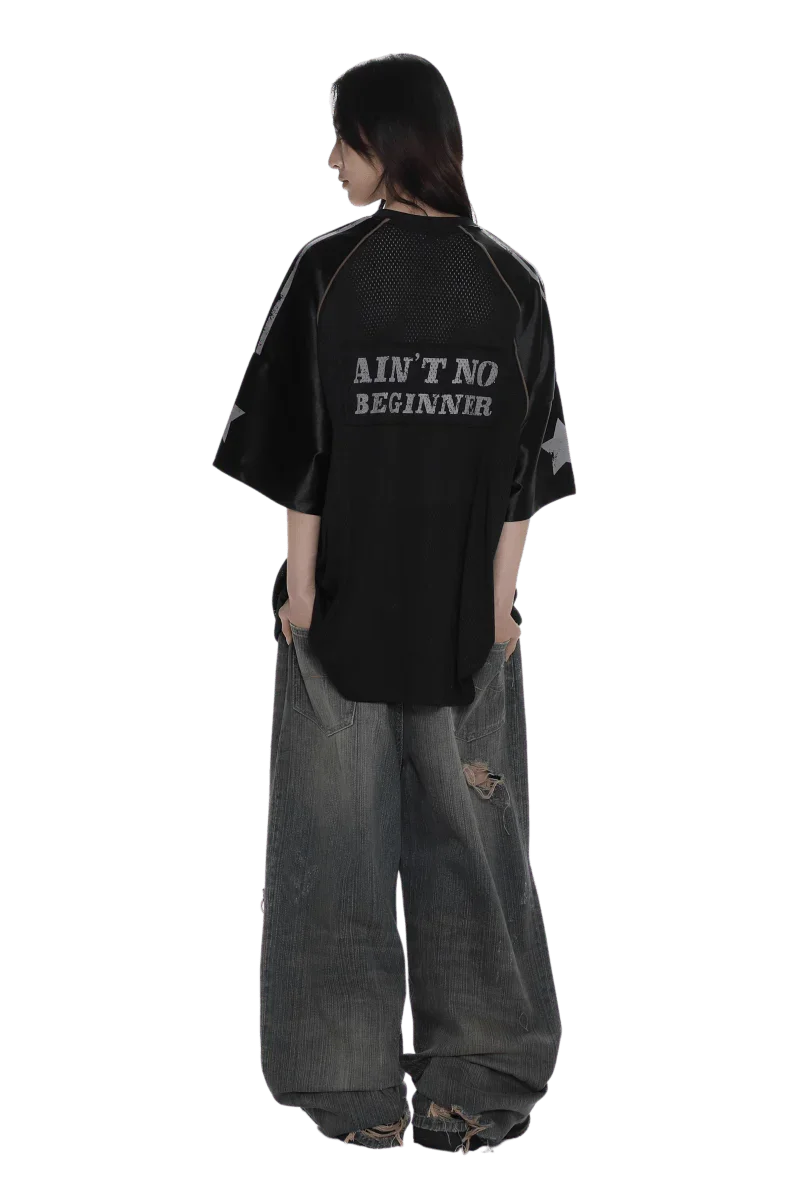 Black 90s star mesh tee by Masonprince with star sleeves and text Ain't No Beginner on back