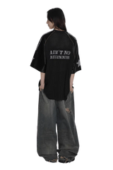 Black 90s star mesh tee by Masonprince with star sleeves and text Ain't No Beginner on back