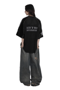 Black 90s star mesh tee by Masonprince with star sleeves and text Ain't No Beginner on back