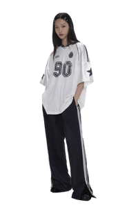 Masonprince 90s star mesh tee white oversized shirt with black numbers worn by model with black pants
