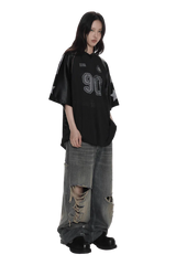 Model wearing Masonprince 90s star mesh tee in black with oversized fit and star details