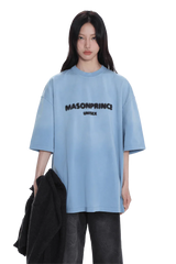 Woman wearing Masonprince 2.0 Faded Logo Gradient Tee in light blue with black gradient text