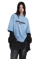 Model wearing Masonprince 2.0 Faded Logo Gradient Tee in light blue with black text and relaxed fit