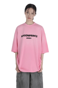 Masonprince 2.0 Faded Logo Gradient Tee in pink worn by model with gray pants unisex style