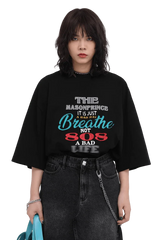Masonprince 808 Breathe Tee black oversized shirt with colorful text worn with black jeans