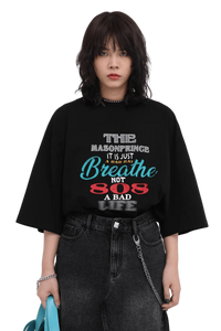 Masonprince 808 Breathe Tee black oversized shirt with colorful text worn with black jeans