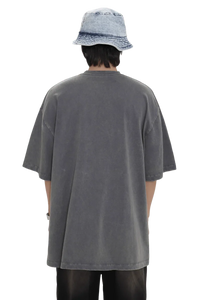Back view of person wearing oversized Masonprince 88 t-shirt in faded gray with short sleeves and bucket hat