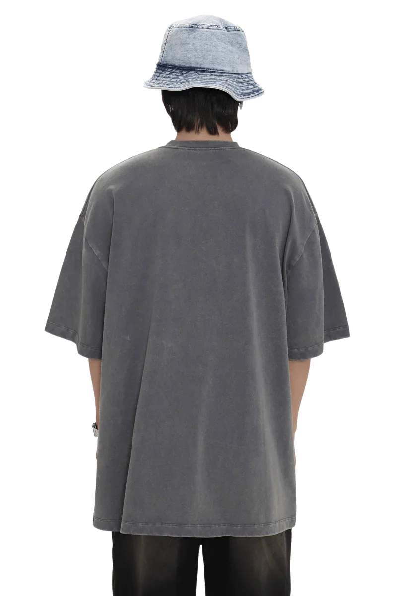 Back view of person wearing oversized Masonprince 88 t-shirt in faded gray with short sleeves and bucket hat