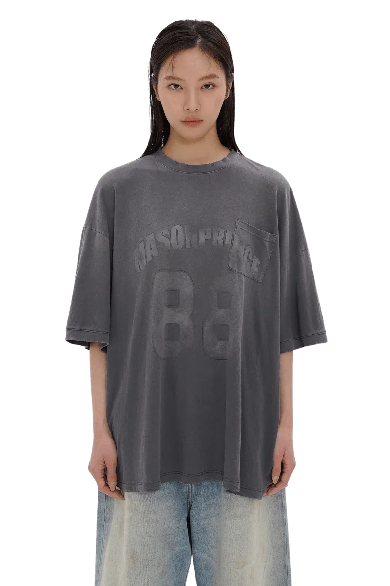 Masonprince 88 t-shirt in faded black with printed logo and pocket worn by female model