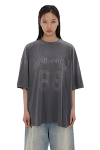 Masonprince 88 t-shirt in faded black with printed logo and pocket worn by female model
